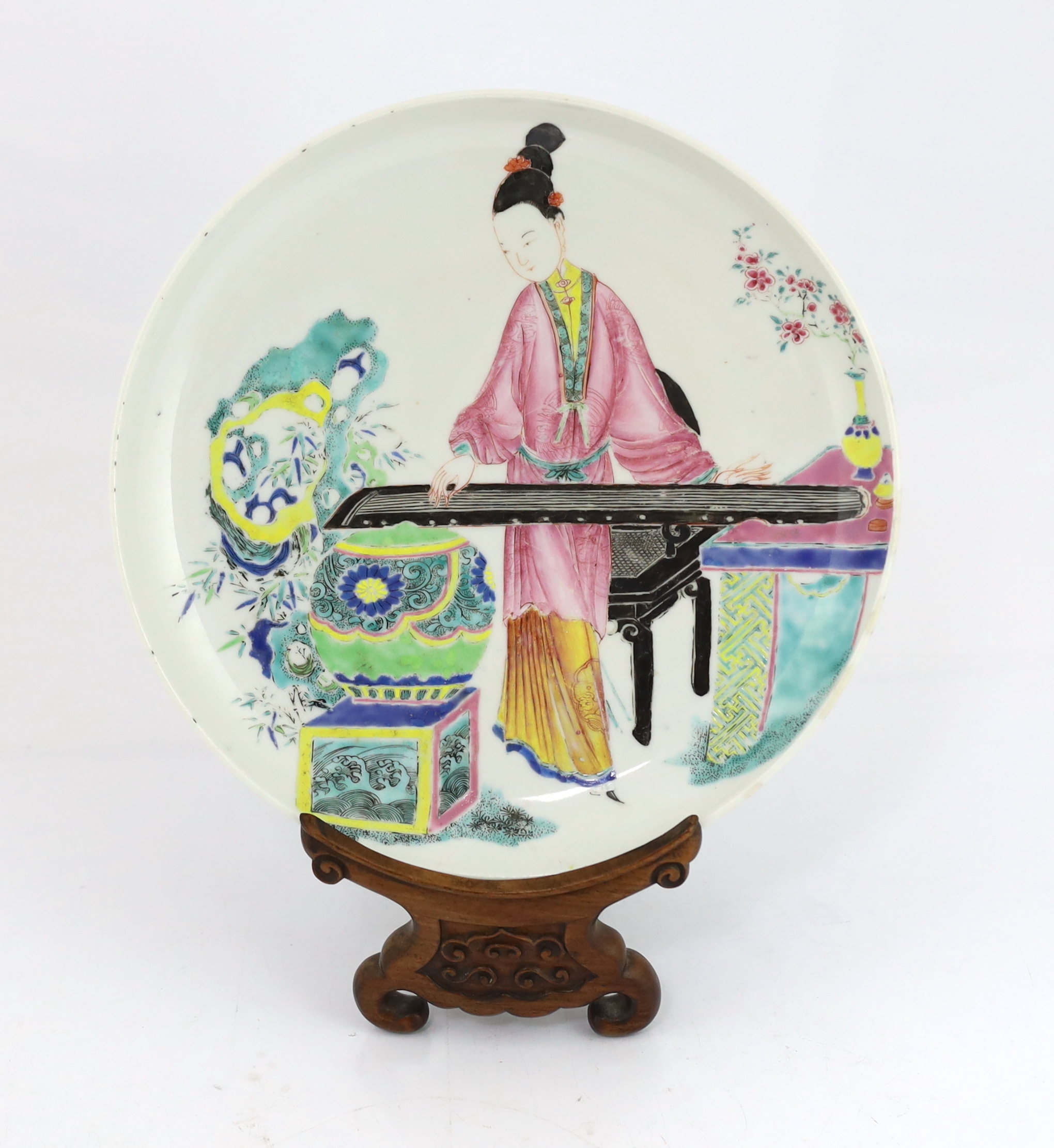 A Chinese famille rose saucer dish, Yongzheng period, repainting to enamel colours, Please note this lot attracts an additional import tax of 5% on the hammer price